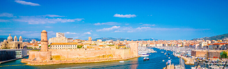 Fototapeta na wymiar Saint Jean Castle and Cathedral de la Major and the old Vieux port in Marseille, France