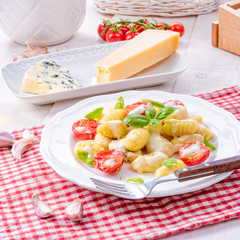 delicious gnocchi with gorgonzola cream sauce and cherry tomatoes