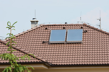 solar panels on the roof of a family house