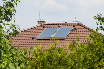 solar panels on the roof of a family house