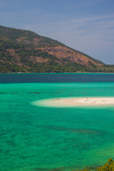 White sand beach beach and long tail boat is floating on sea at ocean in Tropicana located at south of thailand 