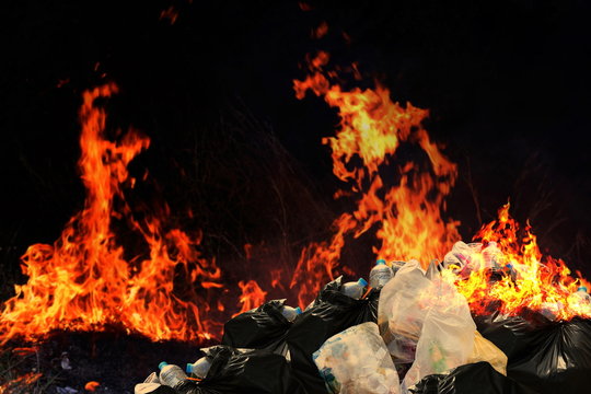 Burn a lot of waste plastic garbage, Garbage bin pile Dump Lots of junk Polluting with Plastic Burning heap of smoke from a burning pile of many garbage waste pollution