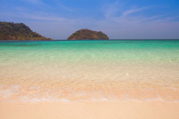 White sand beach with moutain under clear sky at ocean in Tropicana located at south of Thailand 