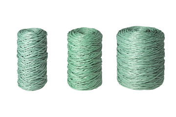 green clew of twine isolated on white background