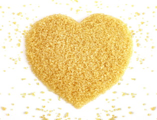 Heart-shaped of Sugar from sugar cane top view, Background granulated sugar yellow brown, Sucrose sugar, Red sugar