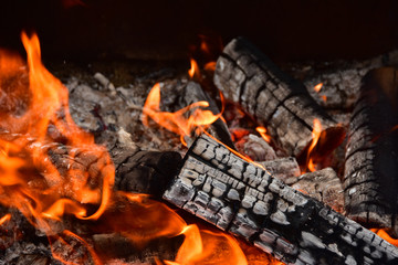 Orange and red flames from campfire.