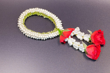 White garland with rose for Buddhism pray to monk on back background