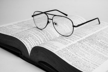 Glasses on open book with black and white style