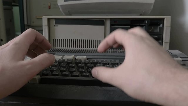 Typing on an old-style 1980s - 1990s computer
