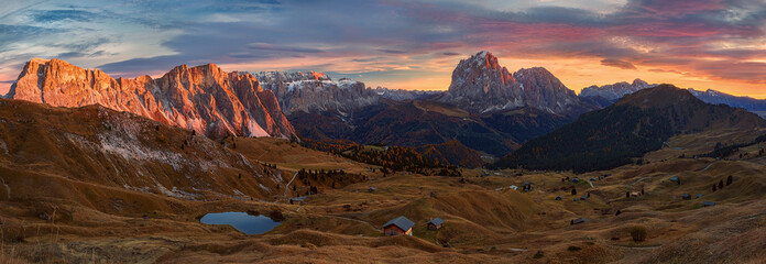 Selva di Val Gardena, Scenic mountain landscape, Italian Dolomites with dramatic sunset and cloudy sky at background. - obrazy, fototapety, plakaty