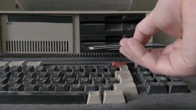 Removing 5.25 Inch floppy disk from old retro personal computer
