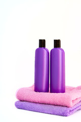 two cosmetic bottles on isolated background