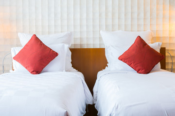 Interior of modern bedroom at hotel with white bed and pillow