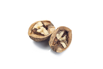 broken walnuts on white background
