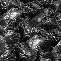 Fototapeta na wymiar Waste background garbage bag black bin, Garbage dump, Bin,Trash, Garbage, Rubbish, Plastic Bags pile junk garbage Trash texture