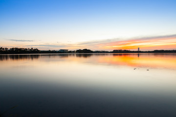 Fototapeta na wymiar Sunset view of lake with colorful sky