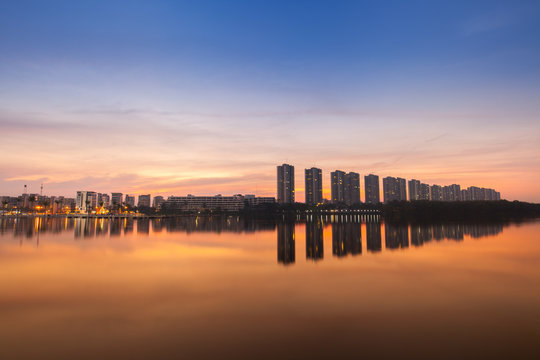 Reflection of condominium on water surface at sunset timing located at impact arina Bangkok Thailand  