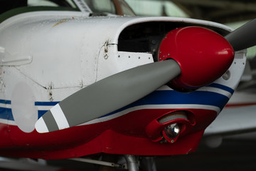 Small Sport Aircraft parked in hangar, close up. detail