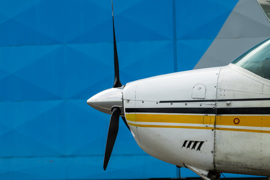 Small Sport Aircraft parked in hangar, close up. detail