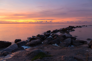 Rocky shore of the sea bay in the quiet evening