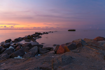 Rocky shore of the sea bay in the quiet evening
