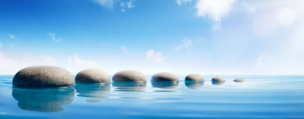 Foto op Canvas Stapstenen in blauw water - Zen Concept © Romolo Tavani