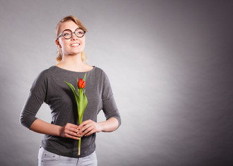 Girl with tulip full of hope dreaming.