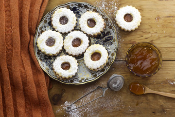 traditional algerian  linzer cookies with apricot jam on plate for holiday