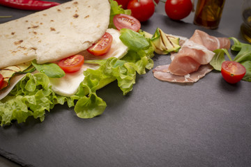 Piadina romagnola with cheese and ham