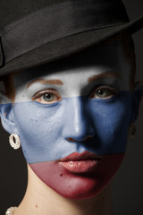Woman face with painted Flag of the Russian Federation