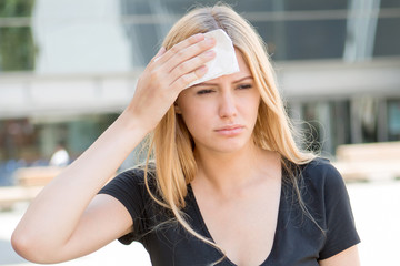 Attractive woman tired of heat in summer