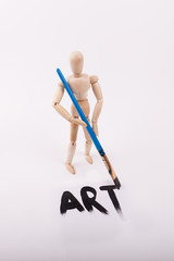 Wood drawing figure model holding paintbrush 