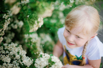 beautiful blond girl outdoor on a summer day. Reuniting with nature. Childhood, lifestyle. 	