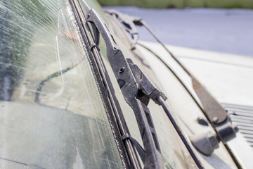 dirty car windshield with the included glass cleaner, in the big city front and back of the background is blurred