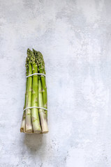 A bunch of asparagus on a Concrete background
