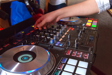 Professional concert dj turntables player device with sound mixer panel and jog wheel.Club disc...