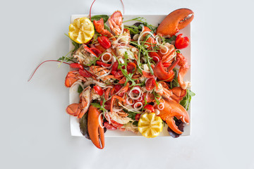 Lobster salad on white background, selective focus.Catalan lobster.Top view.