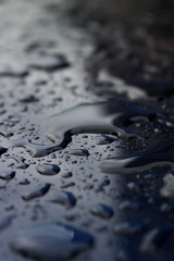  Water drops on a blue metal surface 