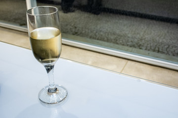 Glass of white wine at table in Brazil