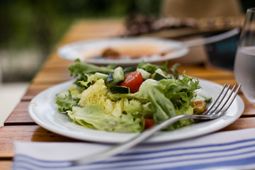 Salad on table outdoors.