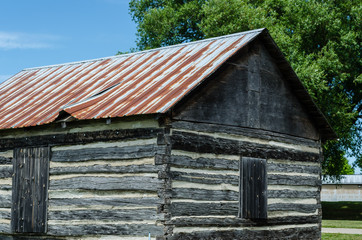 Fototapeta na wymiar Three quarter view of a pioneer log cabin