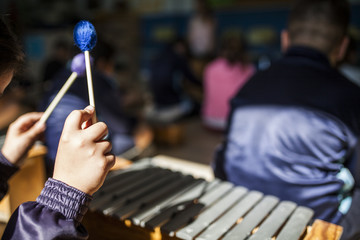girl playing xylophone