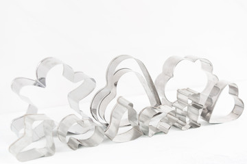 Various metal cutter for baking with selective focus in center o the white background