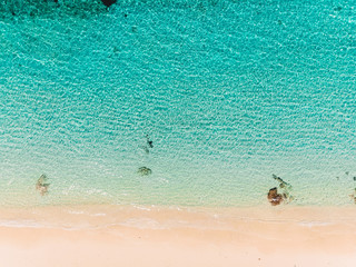 Top view of beautiful sand beach with turquoise ocean water, aerial view