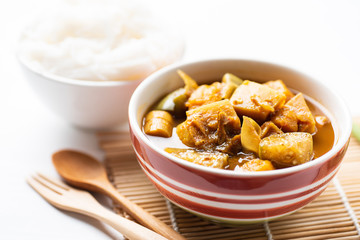Fish organs sour soup (Kaeng Tai Pla) in a bowl and rice noodles, Southern Thai food