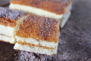 fresh sweet homemade delicious cake on wooden background