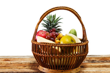 Fruit background,together,orange,apple,grape,mango,myanma grape,pine apple,cucumber,many fresh fruits mixed in bambooon basket