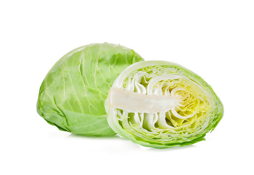 whole and half sliced green pointed cabbage with half isolated on white background