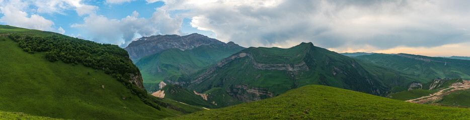 Fototapeta na wymiar Ultra wide angle green mountain landscape