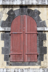 Old wooden door in a brick archway. Close up